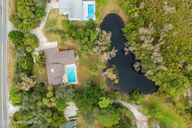 birds eye view of property with a water view