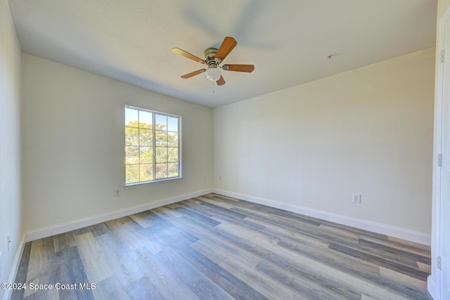 spare room with ceiling fan and light hardwood / wood-style floors