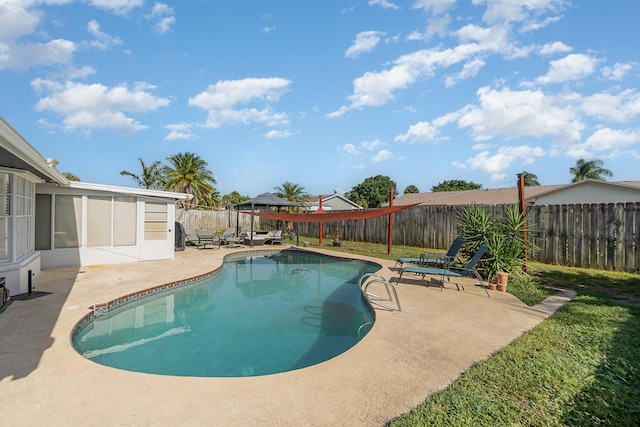 view of pool with a gazebo, a patio area, and a sunroom