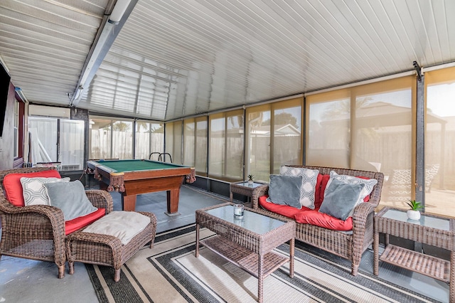 sunroom / solarium featuring lofted ceiling and billiards