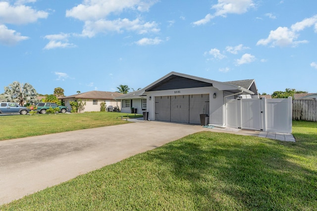 ranch-style home featuring a front lawn and a garage