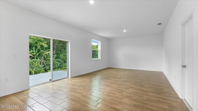 empty room with light hardwood / wood-style floors