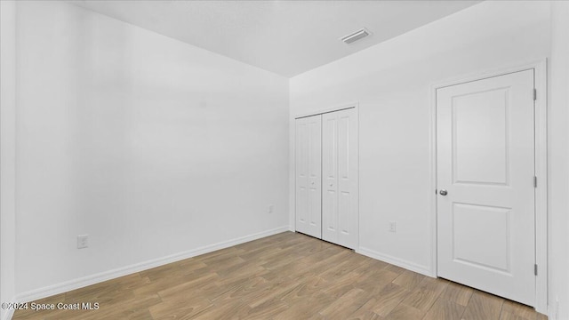 unfurnished bedroom with light hardwood / wood-style floors