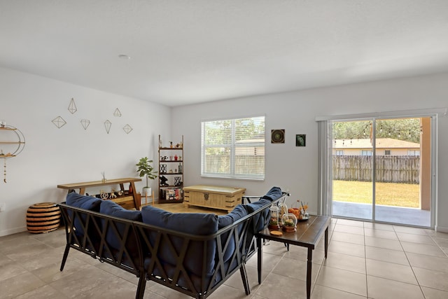 living room featuring a healthy amount of sunlight and light tile patterned floors