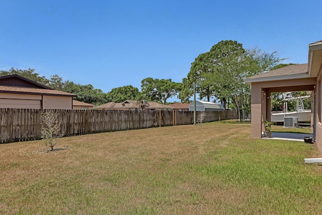 view of yard featuring central air condition unit