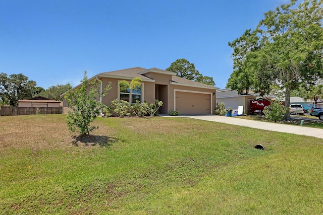 view of front of property featuring a garage and a front lawn