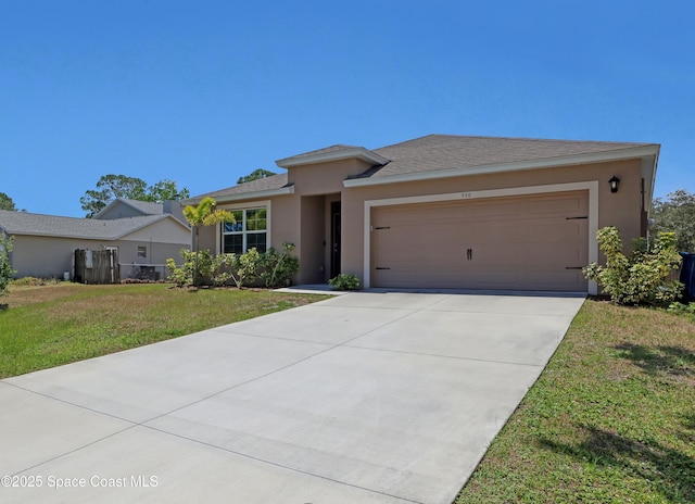 view of front of home with a garage and a front yard