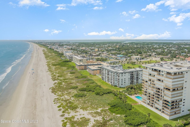 aerial view featuring a view of the beach and a water view