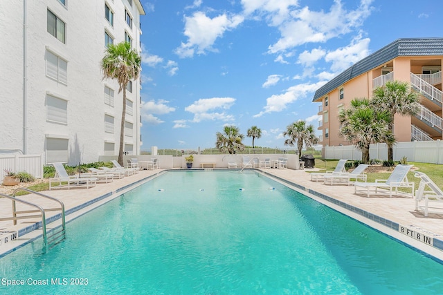 view of swimming pool with a patio area