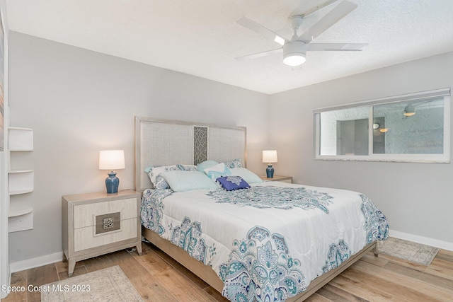 bedroom featuring ceiling fan and light hardwood / wood-style flooring