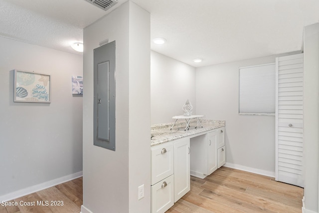 650 N Atlantic Ave # 706, Cocoa Beach, FL 32931 - bar area with light wood-type flooring, electric panel, and recessed lighting