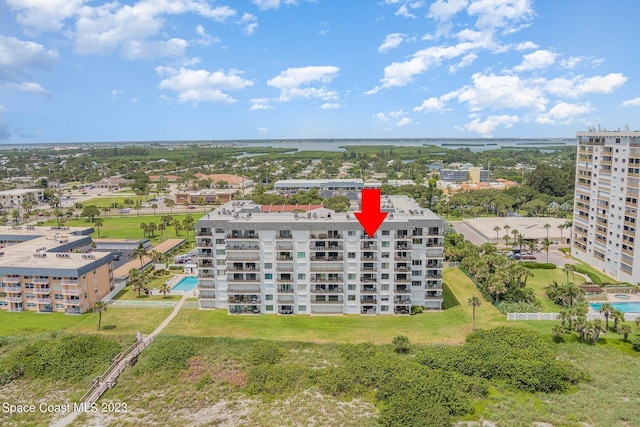 650 N Atlantic Ave # 706, Cocoa Beach, FL 32931 - aerial view of apartment complex / building and a pool area