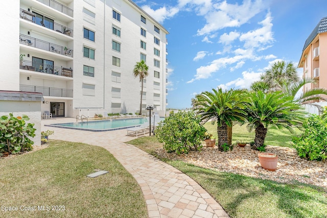 650 N Atlantic Ave # 706, Cocoa Beach, FL 32931 - community pool with a lawn