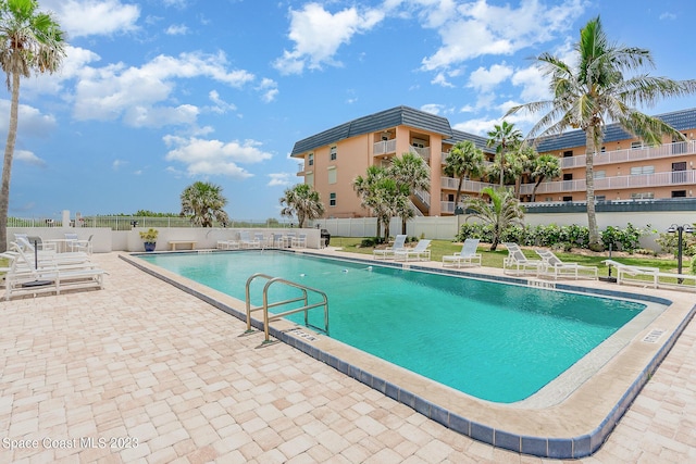 view of swimming pool with a patio