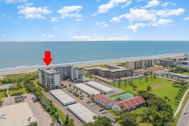 bird's eye view featuring a water view and a view of the beach