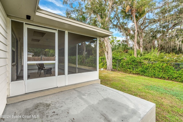 view of patio / terrace featuring a sunroom