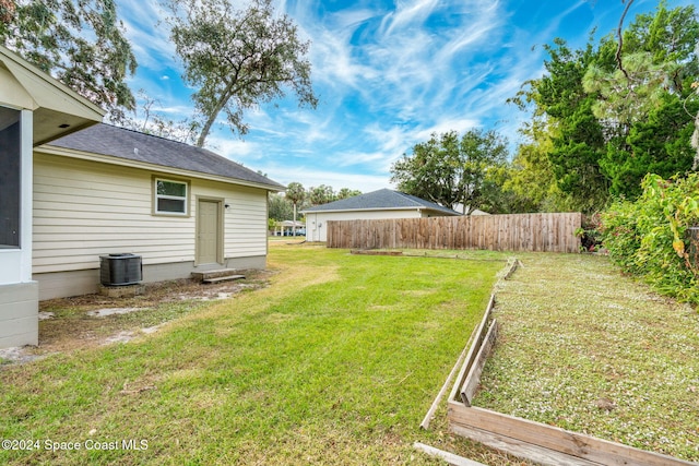 view of yard featuring central AC unit