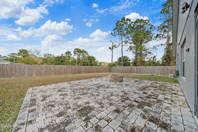 view of patio / terrace featuring a fire pit