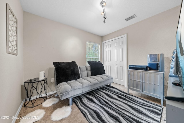 living area with light carpet