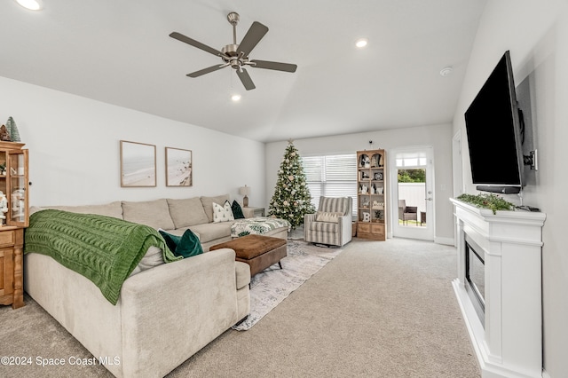 living room featuring ceiling fan and light colored carpet