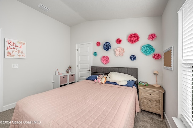 carpeted bedroom with vaulted ceiling