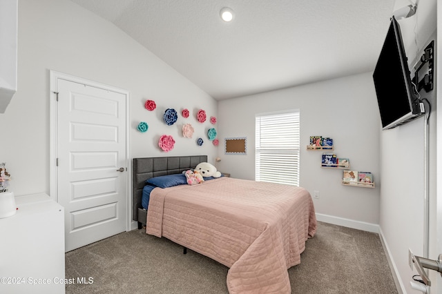 bedroom with carpet floors and vaulted ceiling