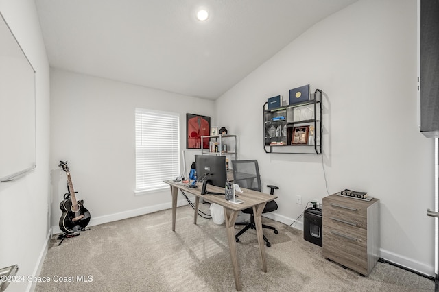 carpeted office with vaulted ceiling