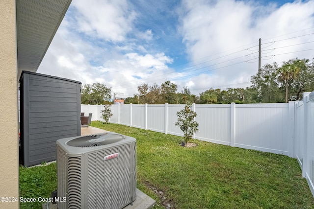 view of yard with central AC