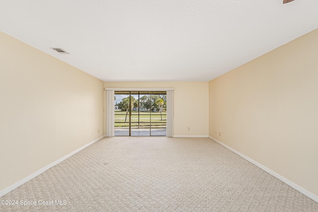 unfurnished room with light colored carpet