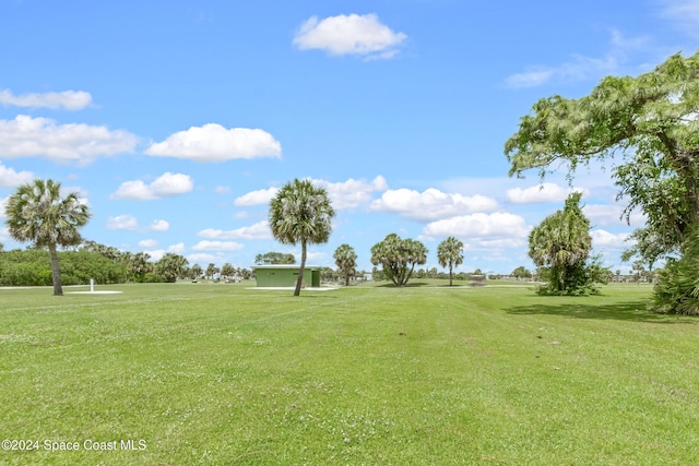 view of property's community with a lawn