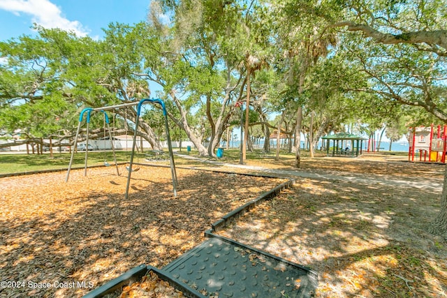 view of jungle gym featuring a water view