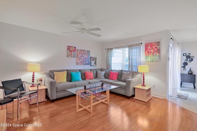 living room with ceiling fan and hardwood / wood-style floors