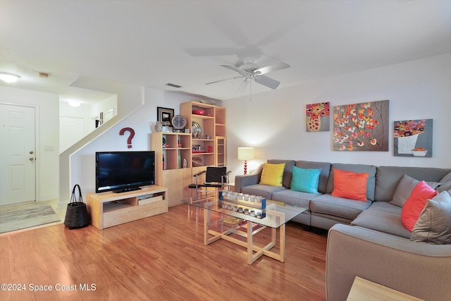 living room with ceiling fan and hardwood / wood-style flooring