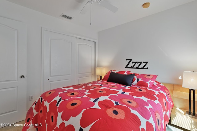 bedroom featuring ceiling fan and a closet