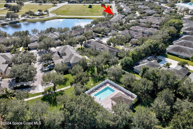 birds eye view of property featuring a water view