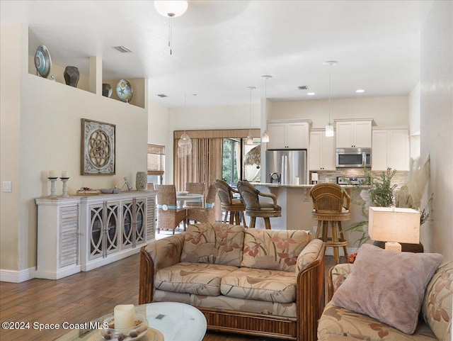 living room with dark hardwood / wood-style floors