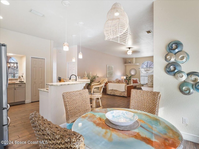 dining area with light hardwood / wood-style flooring