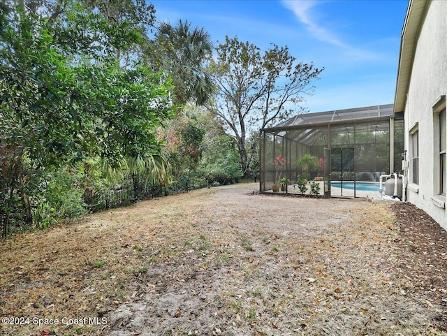 view of yard with a lanai