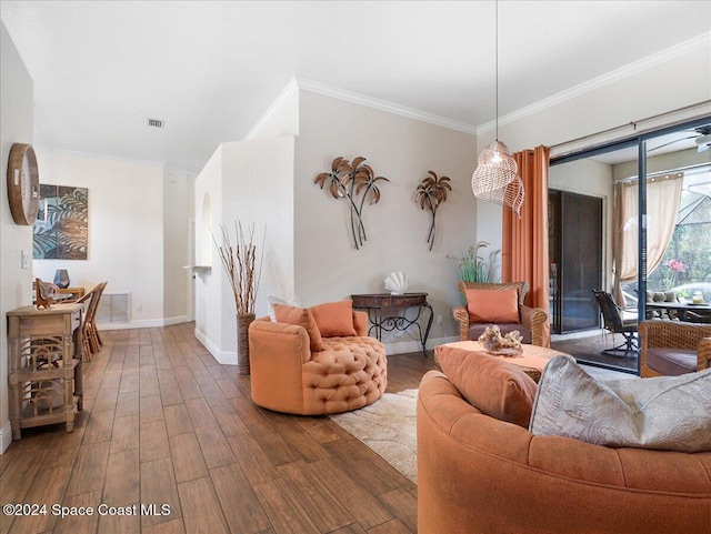 living room featuring dark hardwood / wood-style flooring and ornamental molding