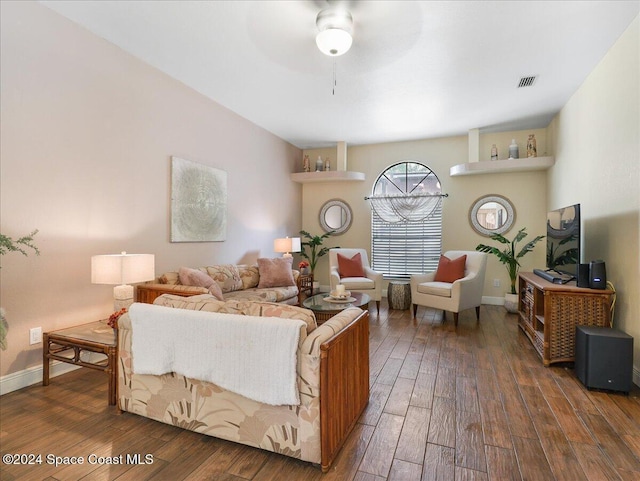 living room with ceiling fan and dark hardwood / wood-style flooring