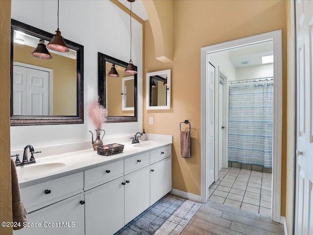 bathroom featuring vanity and wood-type flooring