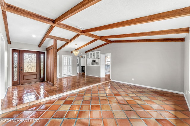 unfurnished living room with a textured ceiling, lofted ceiling with beams, tile patterned floors, and a notable chandelier