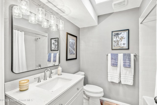 full bathroom featuring shower / tub combo, vanity, a skylight, and toilet