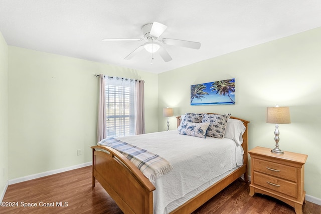 bedroom with ceiling fan and dark wood-type flooring