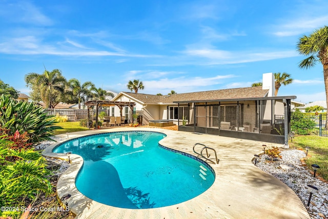 view of pool featuring a pergola, a patio area, and a sunroom