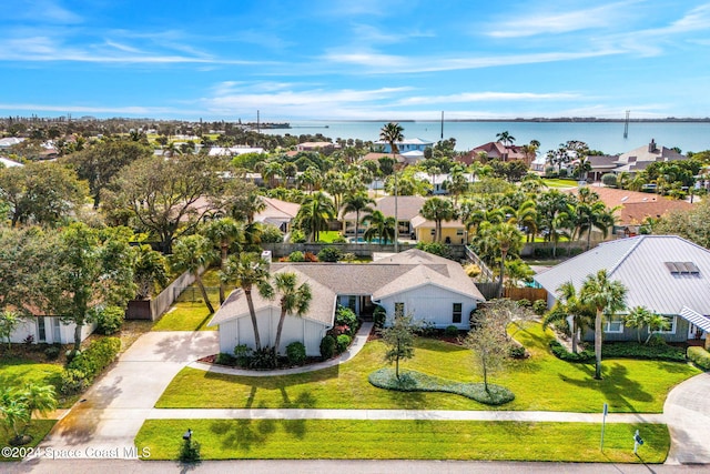 birds eye view of property featuring a water view