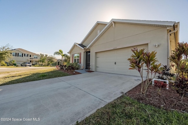 view of side of home featuring a garage