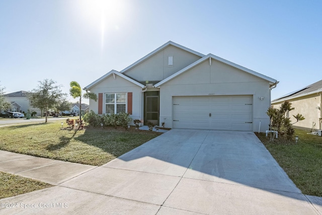 view of front facade featuring a front lawn and a garage