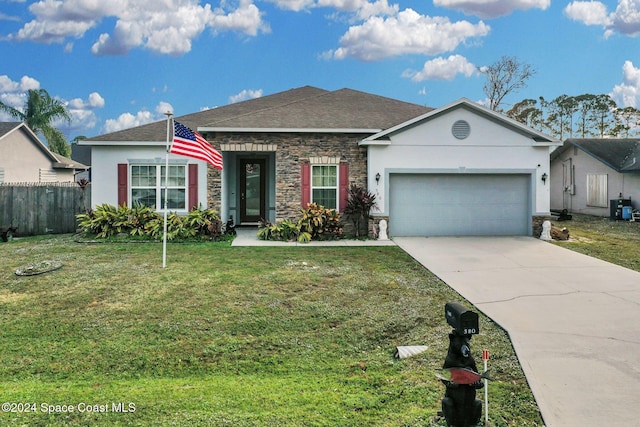 ranch-style house with a front yard, central AC, and a garage