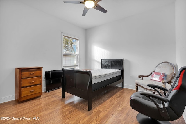 bedroom featuring ceiling fan and light hardwood / wood-style flooring